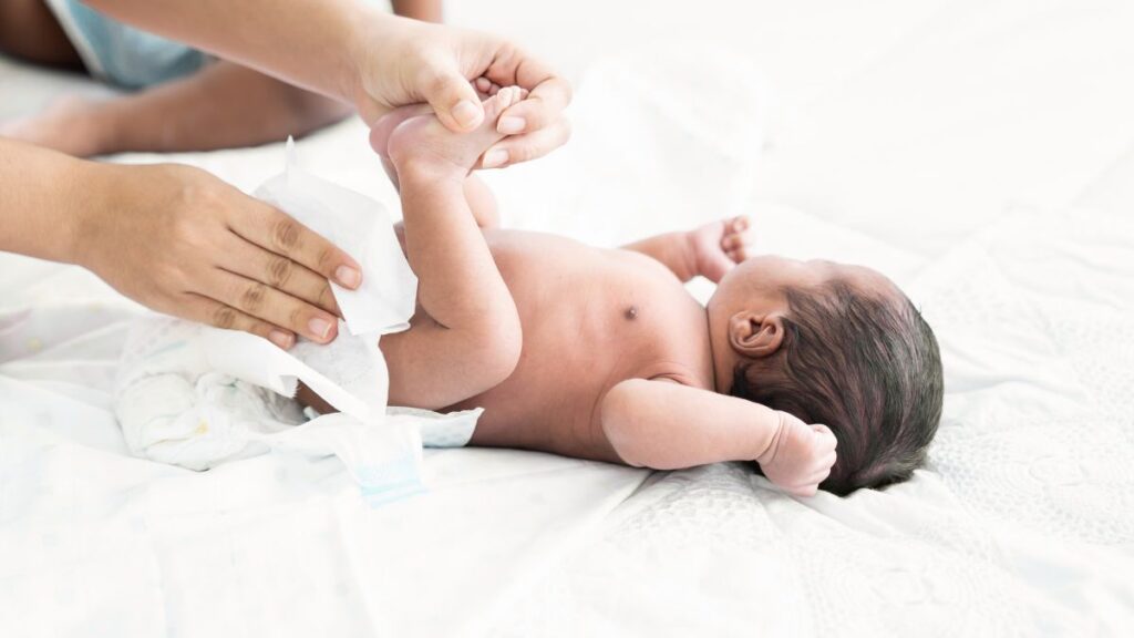 cleaning baby with wet wipes